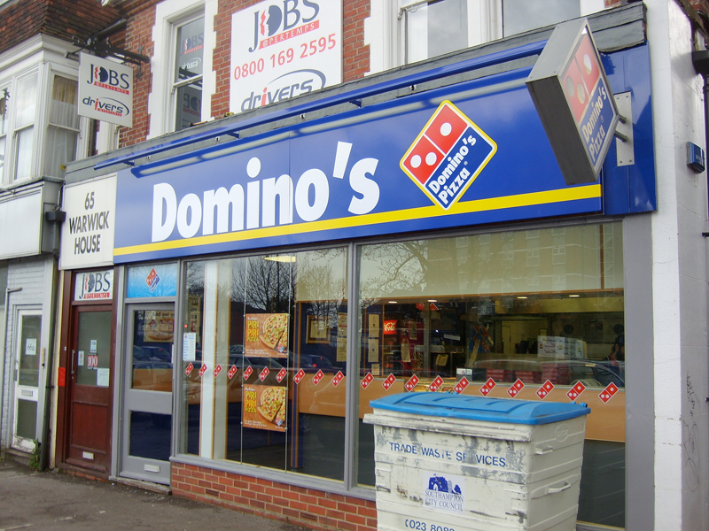 Dominos shop fascia signage that sells